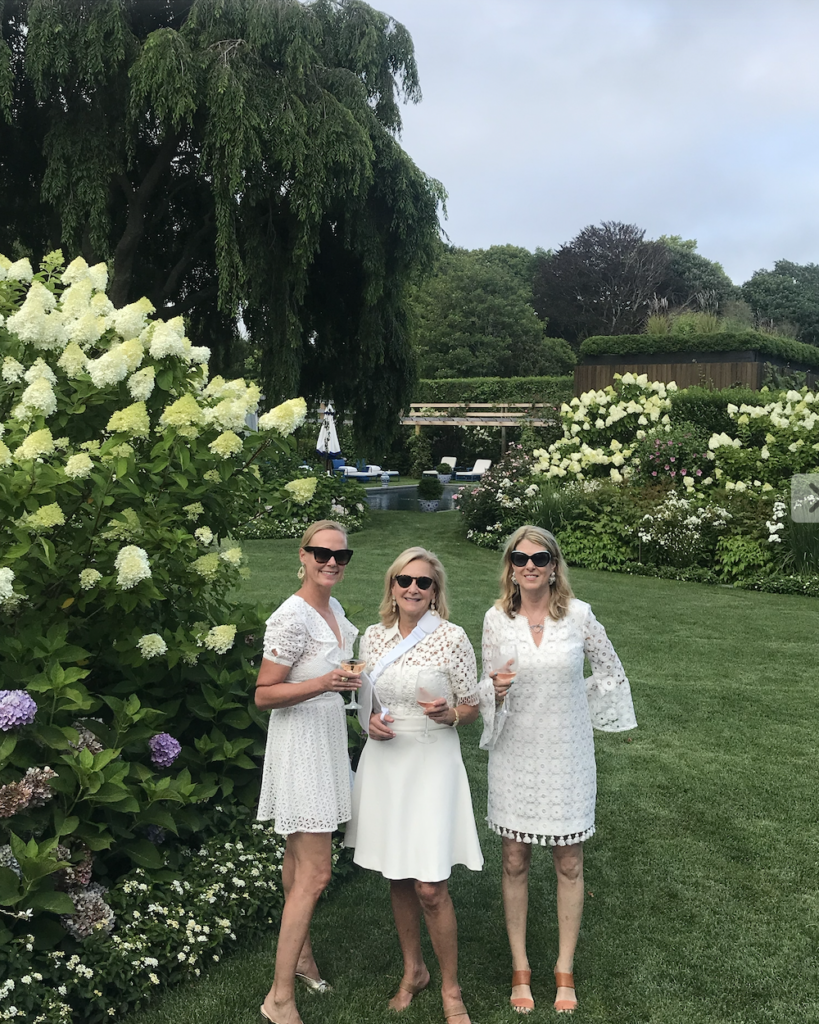 Hilary Dick, Karen Klopp, Ann Colley in white dresses.